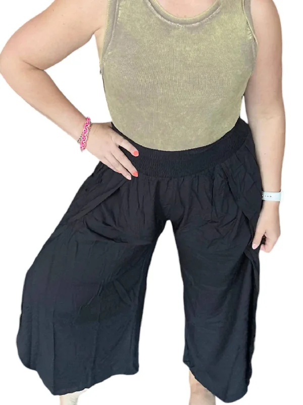 Bootcut women trousers to pair well with different shoesMandy Smocked Waist Pants With Tulip Slit In Black