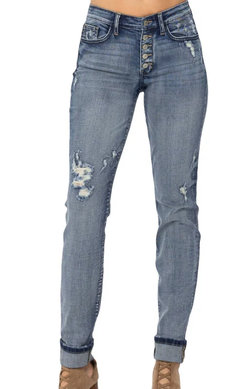 Ripped women jeans for a rebellious and fashion - forward styleMid Rise Button Fly Boyfriend In Washed Denim