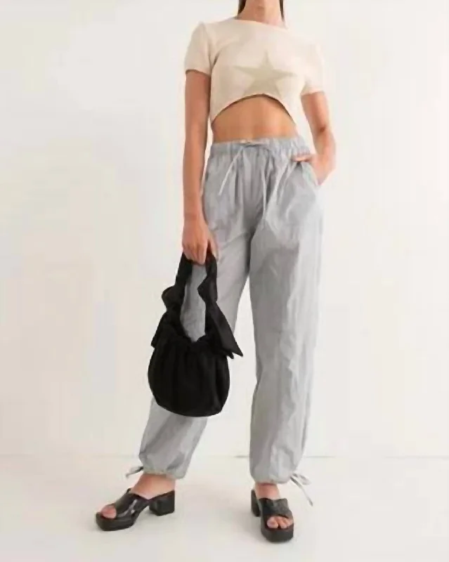 Pleated women trousers for a sophisticated and formal lookNylon Parachute Pants In Dove Grey