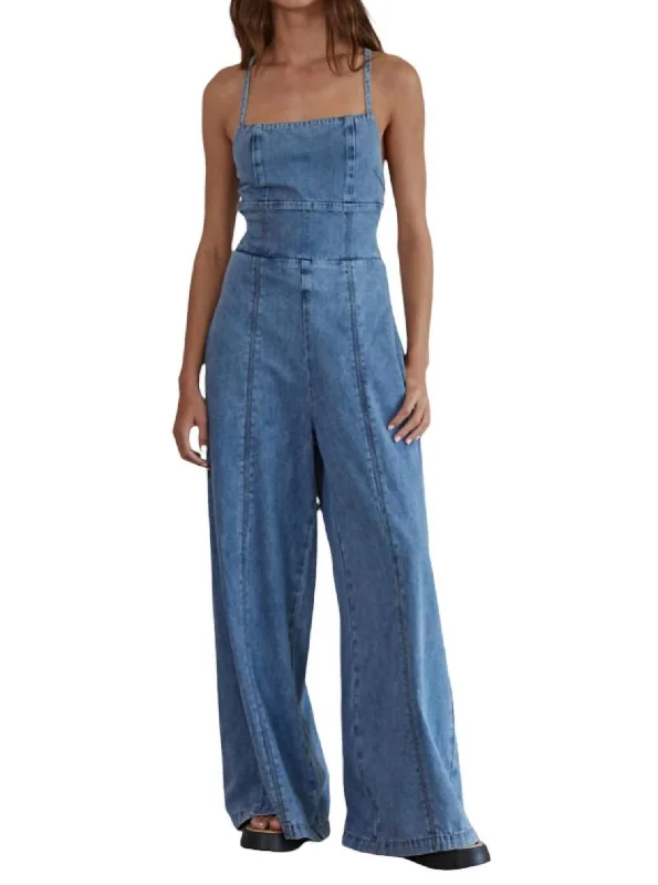 Embellished women jeans with studs or rhinestones for a glamorous touchRecords On Denim Jumpsuit In Denim Blue